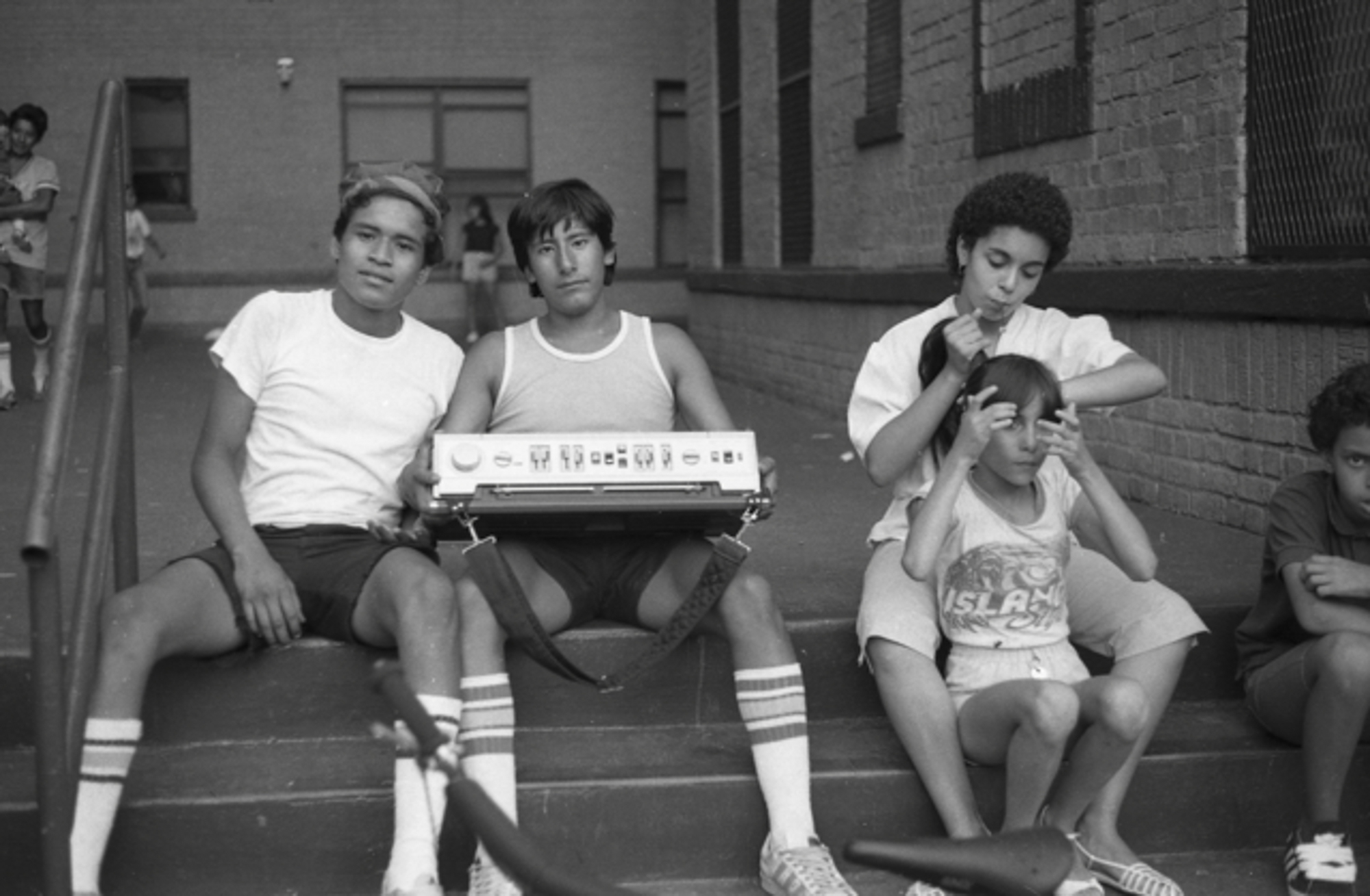Hanging out on the stoop, South Bronx, 1983.  Photo by Ricky Flores
