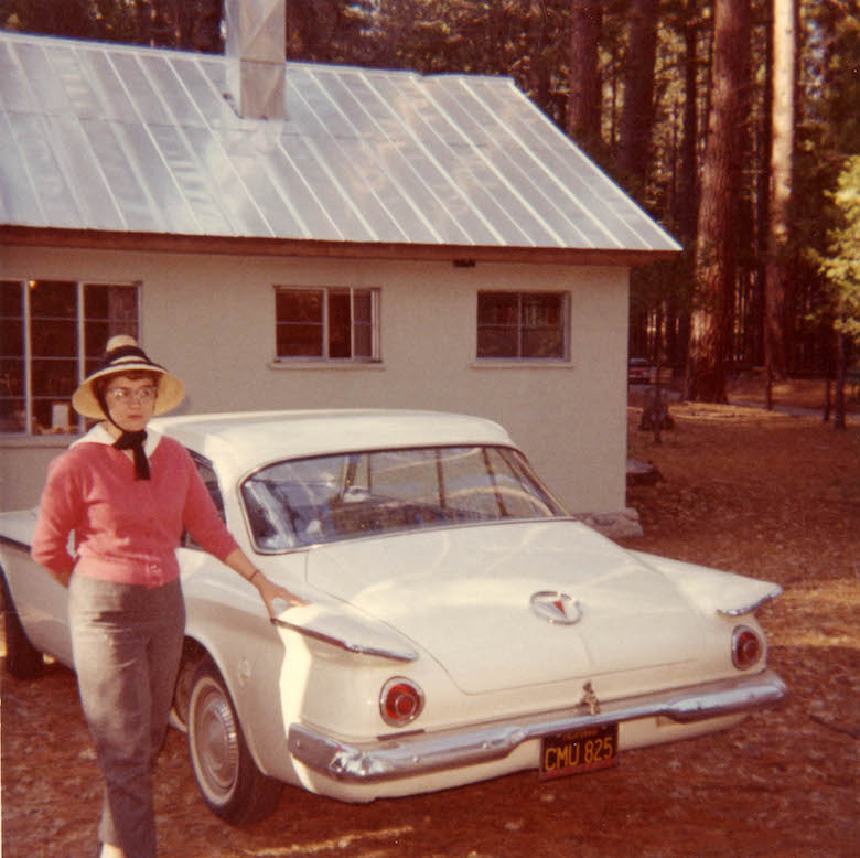 untitled_portrait_of_a_woman_in_a_pink_sweater_with_a_white_automobile_unknown_photographer_around_1950-60
