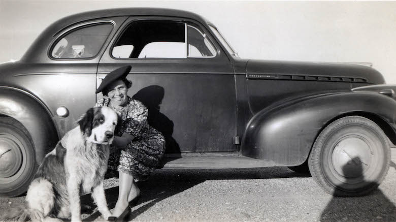 untitled_portrait_of_a_woman_with_her_dog_sitting_on_an_automobile_unknown_photographer_around_1940-50